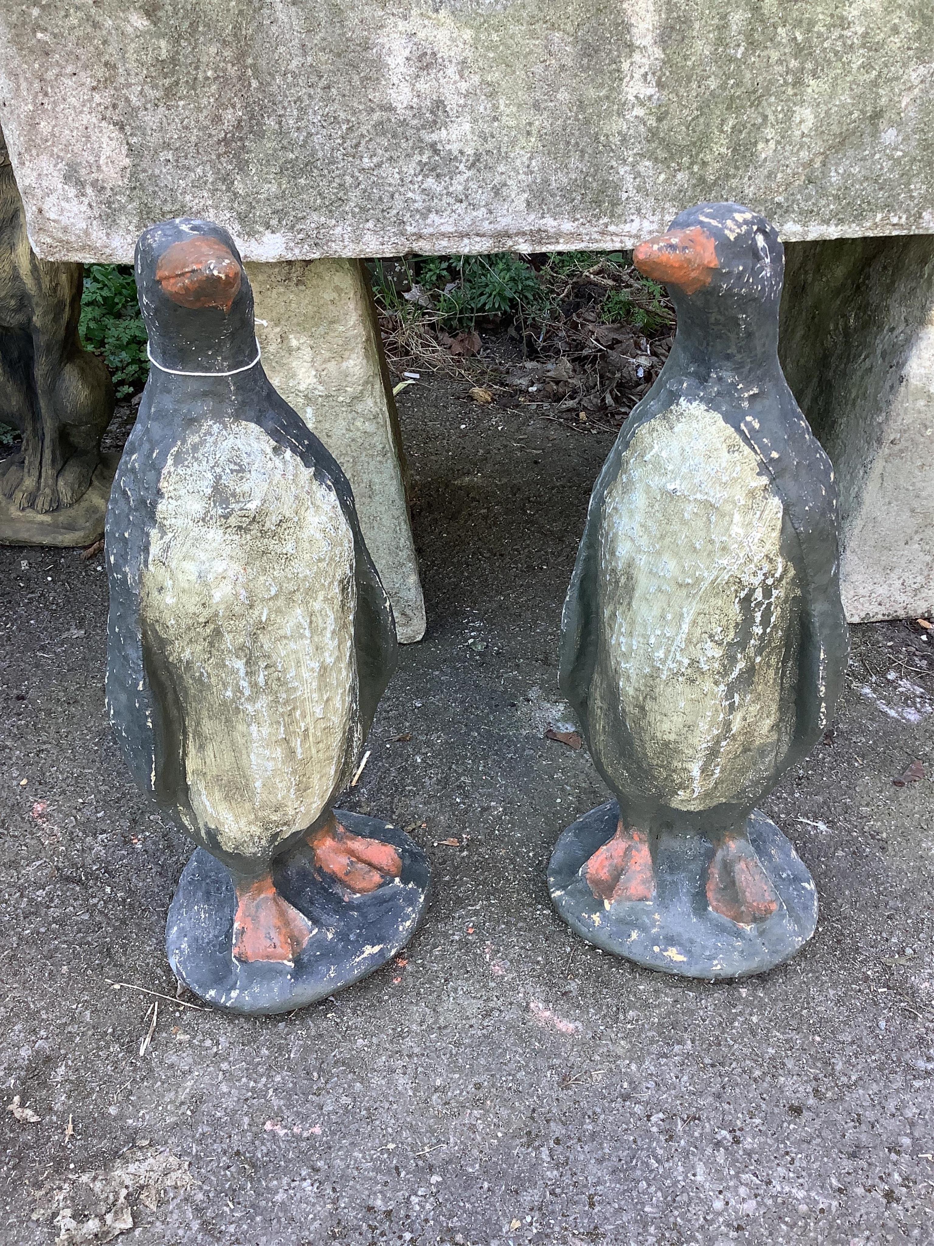 A pair of cast penguin garden ornaments, height 65cm. Condition - fair